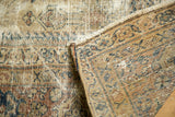 Distressed Mahal carpet's folded corner, showing mostly even wear and restrung foundation.