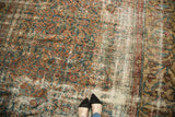 Distressed Mahal carpet showing even wear, teal and red herati motifs, camel vinery border.