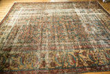Distressed Persian Mahal carpet, showing worn Herati field and primitive border vinery.