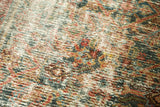 Distressed vintage Mahal carpet pile revealing exposed foundation and colorful motifs.