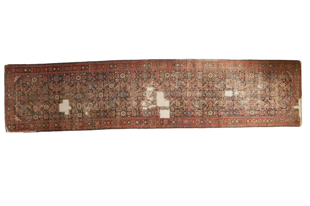 Distressed antique Fereghan runner, allover Herati pattern, charcoal, blush, and time-softened hues. 3'4" x 14'8".