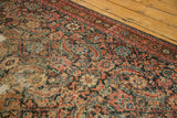 Distressed texture of the antique Fereghan Herati pattern in charcoal, blush, and teal.