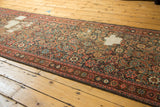 Distressed Herati pattern of the antique Fereghan runner, revealing its woven foundation.