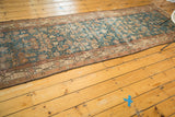 Distressed Malayer runner featuring sky blue Herati motif field and a blush crab border.