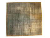 Distressed Indo Arts and Crafts carpet, faded ocean green with visible foundation, saffron border.