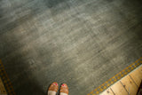Distressed ocean green Indo Arts and Crafts rug shows mostly even wear and Laleh Abassi border.