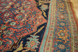 Herati motif field, navy arabesque corner, and classic samovar border of an antique Bijar rug.