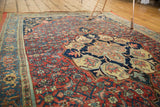 Antique Halvaie Bijar carpet detail: scalloped roundel, paisley boteh, Herati, red and navy.