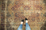 Antique Kerman carpet, distressed mil fleur motif, trefoil elements, deep wine red, sky blue, ivory.