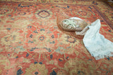 Antique Mahal carpet showing cinnabar red, saffron yellow, palmettes, and foundation revealing wear.