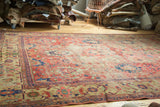 Antique Mahal carpet with cinnabar red palmettes, meandering vines, and mostly even foundation wear.