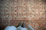 Worn Herati motif on antique Persian Mahal carpet, showcasing knot heads and muted ivory, blush, blue tones.