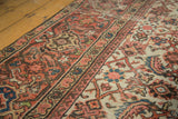 Intricate herati motif and mostly worn pile revealing foundation on antique Mahal carpet.