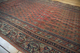 Antique Malayer rug's dusty blush field featuring mir boteh and Laleh Abassi pawn border.