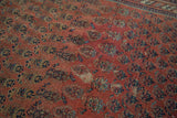 Antique Malayer rug's mir boteh design, dull rose and navy, displaying isolated foundation wear.