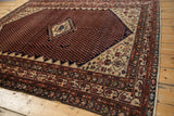 Vintage Mission Malayer rug with stepped medallion, dark blue mahi-mahi field, and ivory border.
