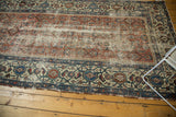Distressed antique Malayer runner, blush rose herati field, visible foundation, and geometric turtle border.