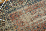 Antique Malayer runner detail with distressed blush rose field and foundation showing through.