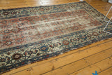 Antique Malayer runner's distressed blush terra cotta field and blue turtle samovar border.