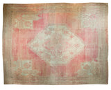 Oversize vintage Oushak carpet with a hexagonal medallion and spandrels in blush pink and sea foam green.