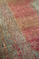 Angled detail of a vintage Oushak carpet showing time-softened tones and an etched wool pile.