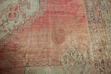 Detail of the etched pile and time-softened blush wool on a vintage Turkish Oushak carpet.