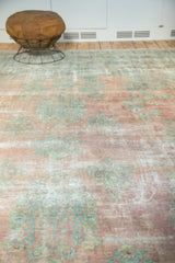 Detail of vintage Kerman carpet in muted blush rose and sea foam green, with classic floral bouquets.