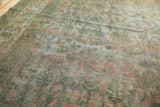 Aged antique Kerman rug pile, dusty rose field, sea foam floral motifs, and visible foundation.
