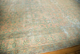 Antique Kerman runner detail: pale blush and sea foam green floral bouquets, with wear to knot heads.