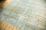 Traditional Kerman carpet border and sea foam green field with repeating floral motifs and gentle wear.
