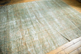 Vintage Kerman carpet showing even wear, light foundation, and sea foam green floral motifs.