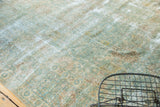Vintage Kerman carpet detail: sea foam green, ivory, beige tone-on-tone floral pattern with visible wear.
