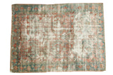 Distressed vintage Mahal carpet featuring faded rose, sky blue, and ivory motifs.