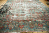 Heavily distressed border of vintage Mahal carpet with faded rose, blue, and ivory motifs.