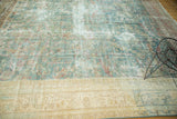 Restored gold border on an antique Mahal with etched wear across its blue and raspberry field.