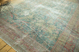 The time-softened pile and mostly even wear of an antique Persian Mahal square carpet.
