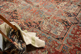 Rectilinear geometric pattern of a vintage Heriz rug with short pile and visible foundation.
