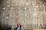 Antique Fereghan carpet border and field, showcasing faded madder red Herati motif and foundation wear.