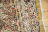 Fereghan carpet's secured side, with worn Herati pattern and exposed plain-woven foundation.