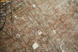 Herati motif in faded red, green, and ivory, with mostly even wear exposing foundation.