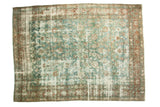 Vintage Kerman carpet, sky blue and wine red floral design, visible foundation wear and horizontal seam.