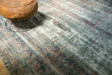 Close-up of a Yezd carpet showing faded Shah Abbas design and teal-aubergine abrashes.
