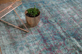 Aubergine and teal-aqua Shah Abbas floral palmettes with scrolling tendrils and abrashes.