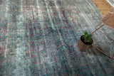 Storied abrash and softened aubergine, teal tones on an antique Yezd rug.