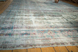 Faded Shah Abas design in teal, aqua, and aubergine abrash on an antique Yezd carpet.