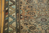 Vintage Borchalou runner detail: serrated leaf border, barber pole ribbon, geometric floral field.