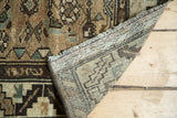 Hand-knotted foundation and beige-brown geometric pile of a vintage Borchalou rug runner.
