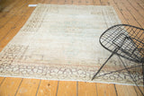 Vintage Tabriz rug with faded diminutive medallion, antique ivory, sea foam, and charcoal tones.