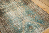 Detail of vintage Malayer runner showing low pile, mint green, and sand Herati motifs.