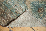 Malayer runner corner, secured fringe, and the striped plain woven foundation.